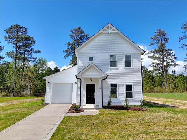 232 Penfield Way, Raeford, NC 28376 - view of front of home with concrete driveway, a front lawn, and a garage