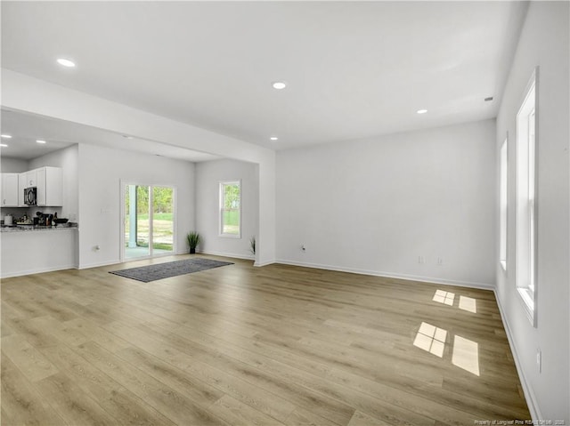 232 Penfield Way, Raeford, NC 28376 - unfurnished living room featuring light wood finished floors, recessed lighting, and baseboards