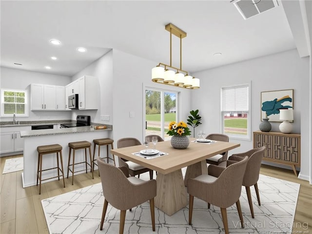232 Penfield Way, Raeford, NC 28376 - dining room featuring light wood-style flooring and recessed lighting
