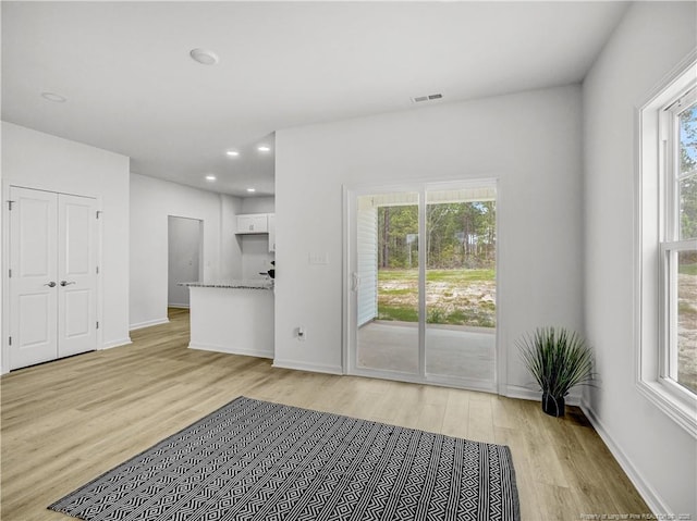 232 Penfield Way, Raeford, NC 28376 - unfurnished living room with light wood-type flooring, recessed lighting, and baseboards