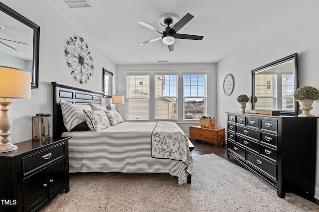 bedroom with visible vents, multiple windows, and ceiling fan