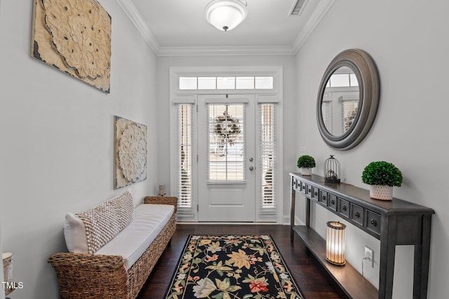 foyer entrance featuring crown molding, dark wood-style floors, and visible vents