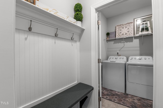 washroom with laundry area and washing machine and dryer