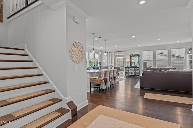 stairs with recessed lighting, baseboards, wood finished floors, and crown molding