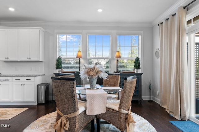 dining room featuring dark wood-type flooring, recessed lighting, baseboards, and ornamental molding