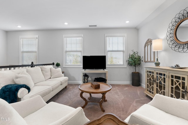 living area featuring carpet flooring, recessed lighting, baseboards, and visible vents