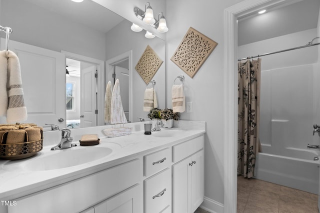 full bath featuring tile patterned flooring, shower / bath combination with curtain, double vanity, and a sink