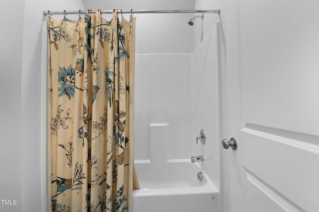 full bathroom featuring shower / bath combo with shower curtain