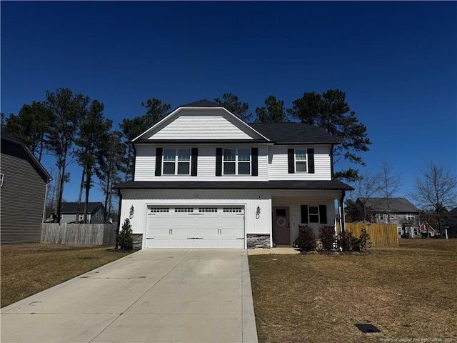 view of front of property featuring stone siding, an attached garage, concrete driveway, and fence