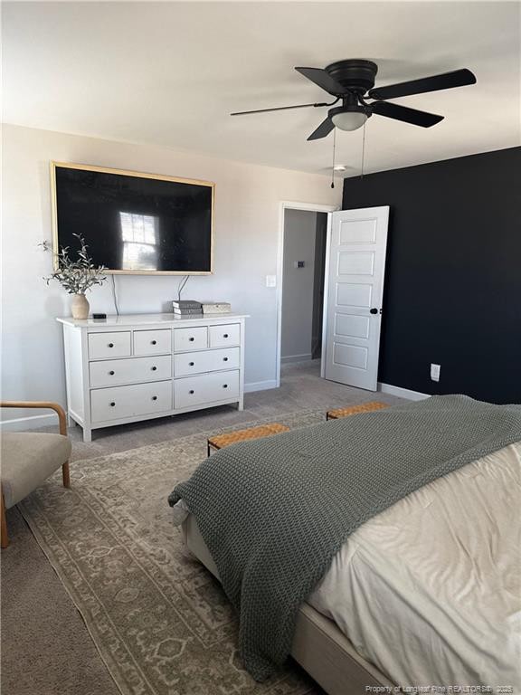 bedroom with baseboards and a ceiling fan