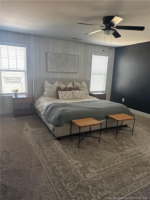 carpeted bedroom featuring ceiling fan