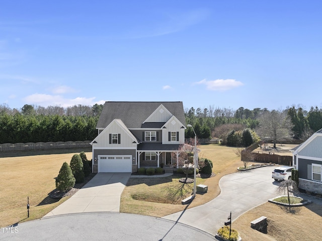 view of front of home with concrete driveway, a garage, board and batten siding, and a front lawn