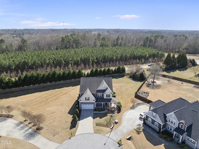 aerial view with a wooded view