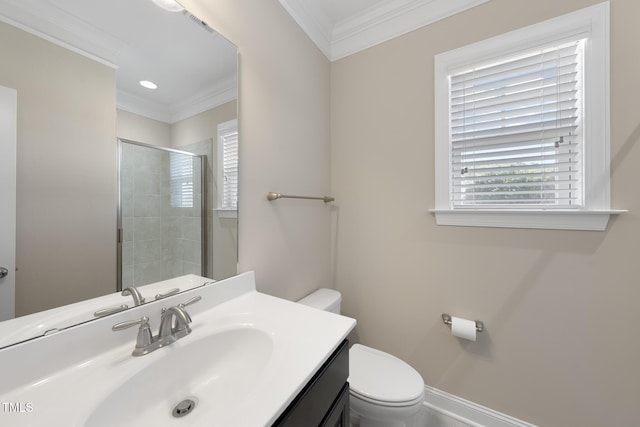 bathroom with plenty of natural light, toilet, and crown molding