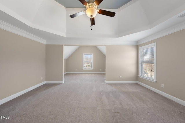 interior space featuring light carpet, ceiling fan, lofted ceiling, and baseboards