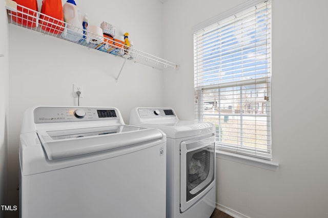 laundry area with laundry area, plenty of natural light, and independent washer and dryer