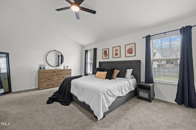 bedroom featuring lofted ceiling, carpet flooring, a ceiling fan, and baseboards