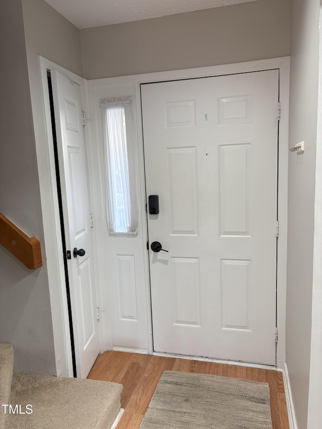 entrance foyer with light wood finished floors