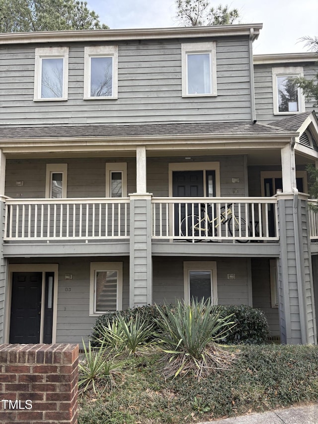 view of front of property with roof with shingles