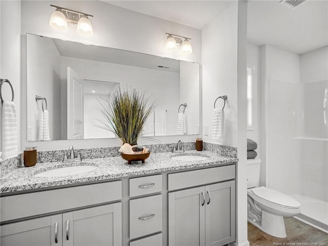 330 Penfield Way, Raeford, NC 28376 - full bathroom featuring double vanity, wood finished floors, and a shower