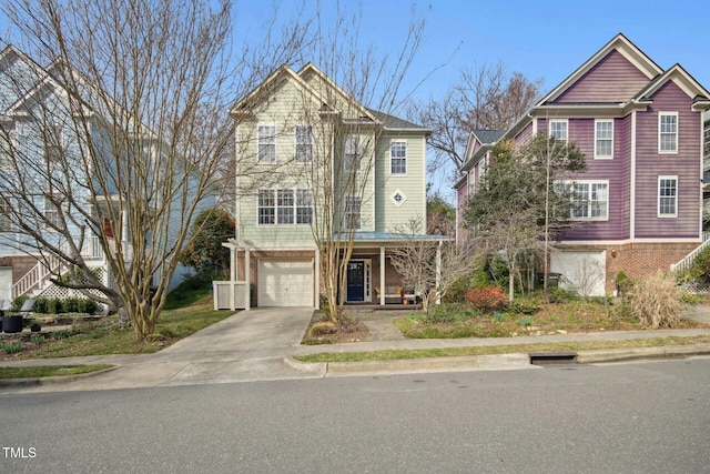 view of front facade featuring a garage, brick siding, covered porch, and driveway