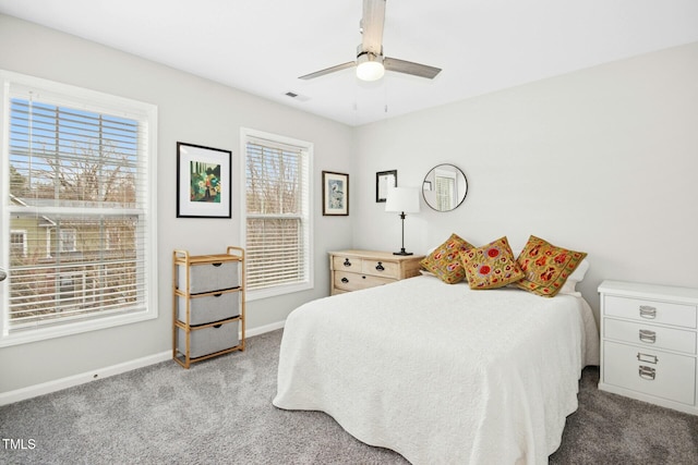 bedroom with visible vents, baseboards, carpet, and a ceiling fan