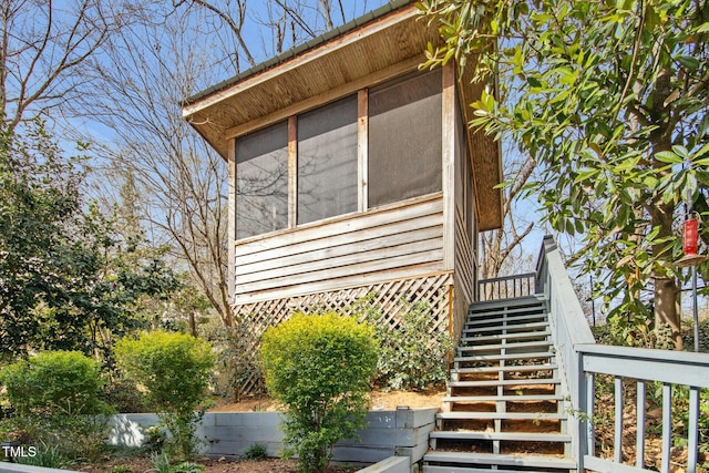 view of home's exterior with stairs