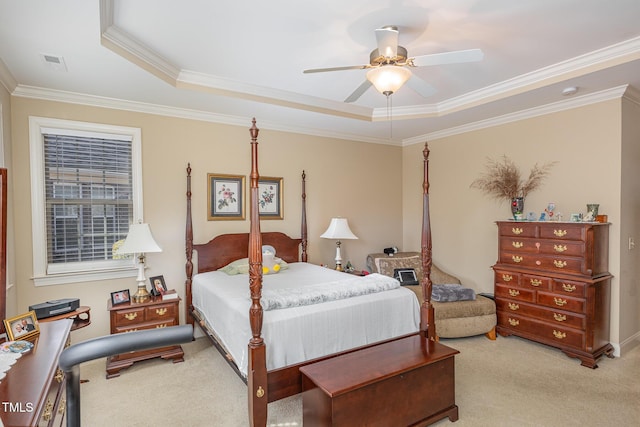 bedroom featuring visible vents, ceiling fan, ornamental molding, light carpet, and a raised ceiling