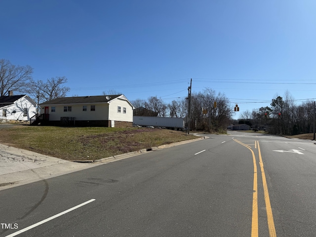 view of street with curbs and traffic lights