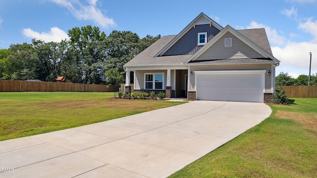 craftsman-style home with board and batten siding, concrete driveway, a front yard, and fence