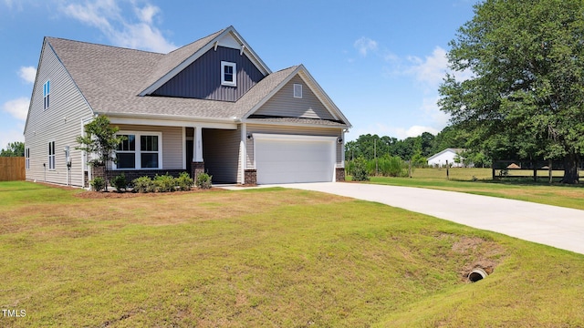 craftsman inspired home featuring driveway, fence, board and batten siding, a front yard, and a garage