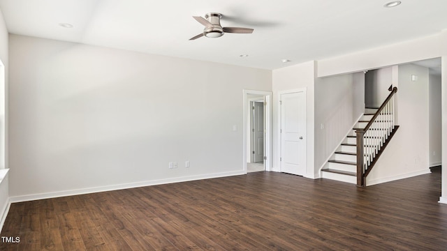 spare room featuring dark wood-type flooring, recessed lighting, baseboards, and ceiling fan