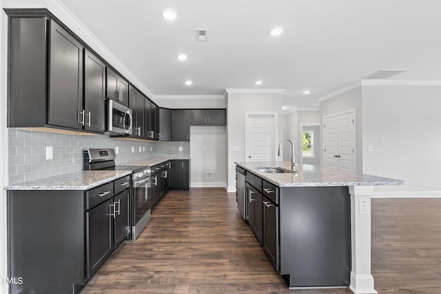 kitchen featuring a sink, light stone countertops, visible vents, and stainless steel appliances