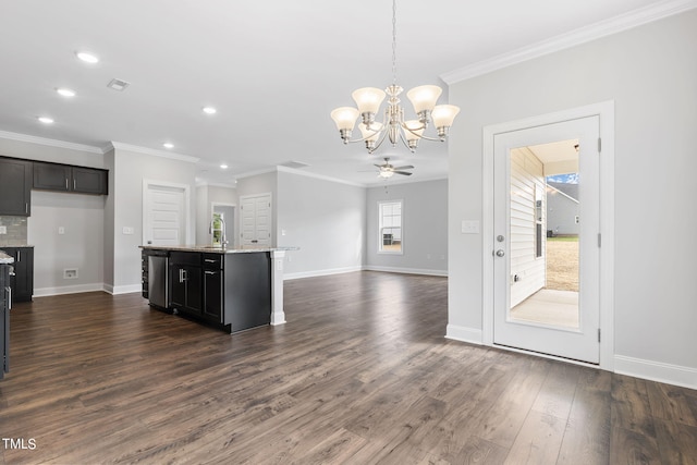 kitchen with dark wood-style floors, open floor plan, ceiling fan with notable chandelier, and crown molding