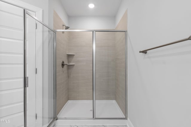 full bathroom with a shower stall