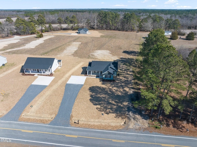 bird's eye view featuring a wooded view