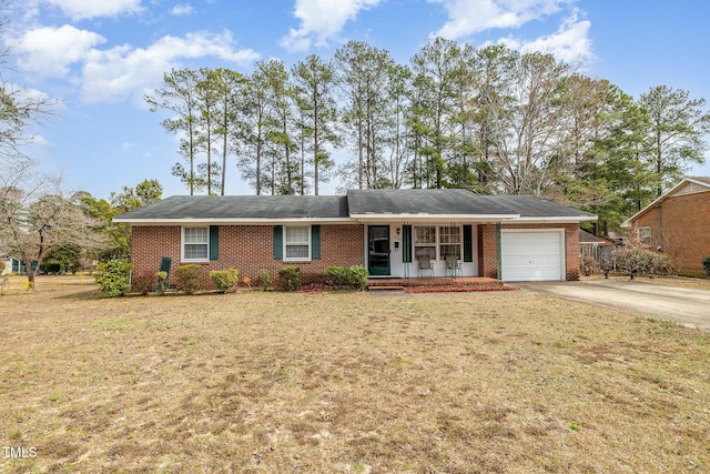 single story home featuring a front lawn, a porch, concrete driveway, a garage, and brick siding