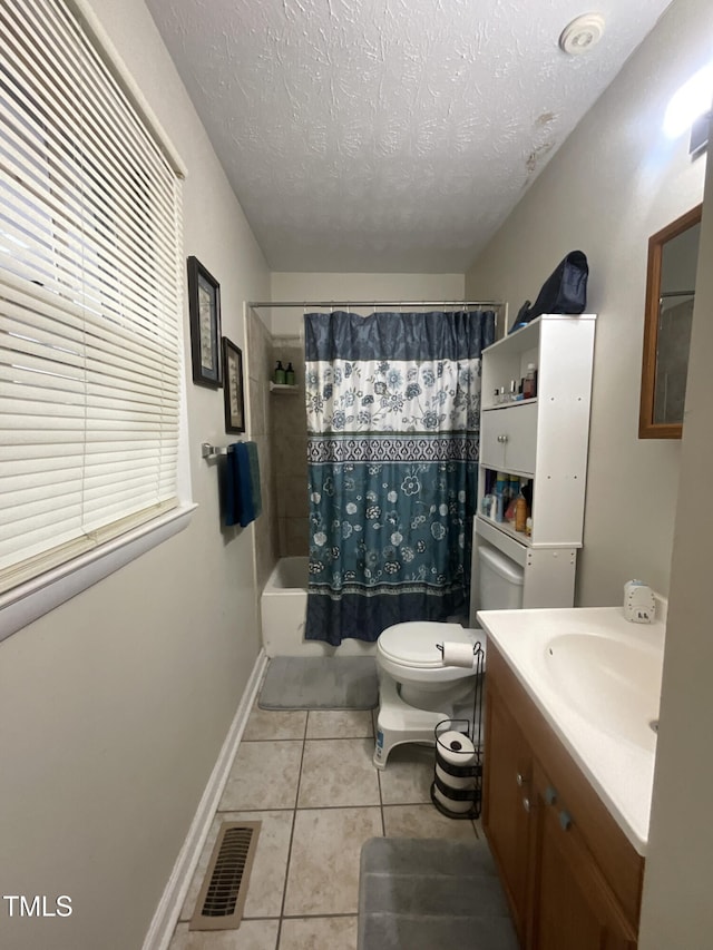 bathroom with tile patterned floors, visible vents, toilet, shower / tub combo with curtain, and a textured ceiling