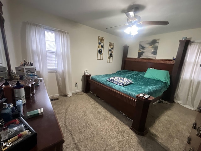 carpeted bedroom featuring baseboards and a ceiling fan