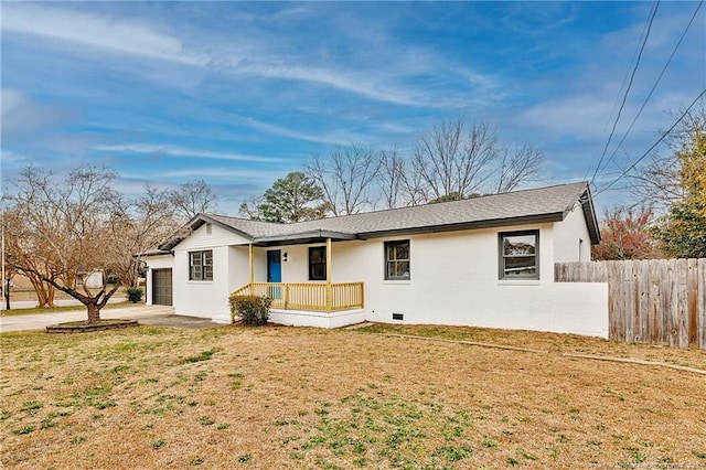 ranch-style house with covered porch, a front lawn, a garage, and fence