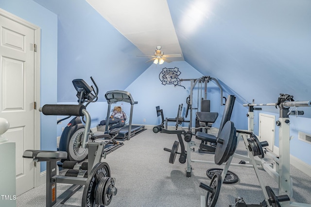 exercise area featuring carpet flooring, baseboards, and vaulted ceiling