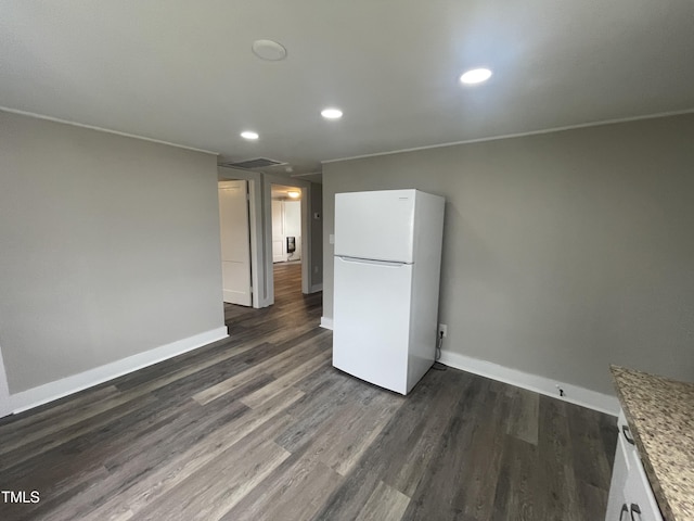 kitchen with recessed lighting, baseboards, dark wood finished floors, and freestanding refrigerator