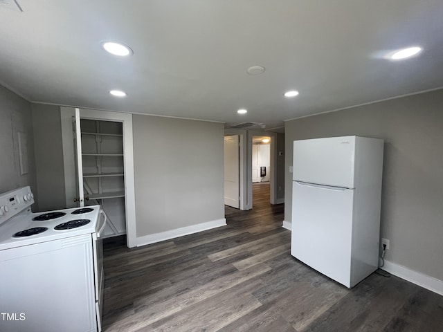 kitchen with dark wood finished floors, recessed lighting, white appliances, and baseboards