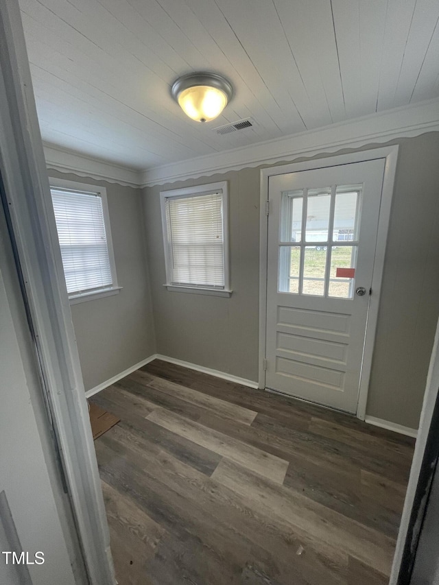 interior space featuring crown molding, visible vents, and a wealth of natural light