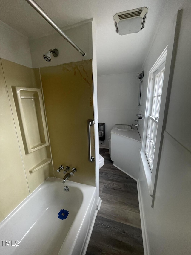 full bath featuring visible vents, toilet, bathtub / shower combination, and wood finished floors