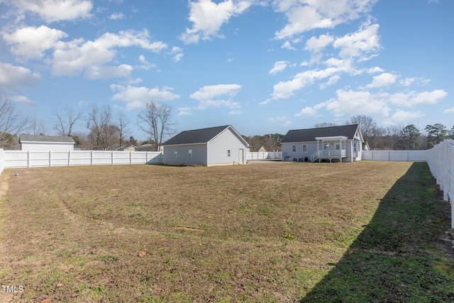 view of yard featuring an outbuilding and a fenced backyard