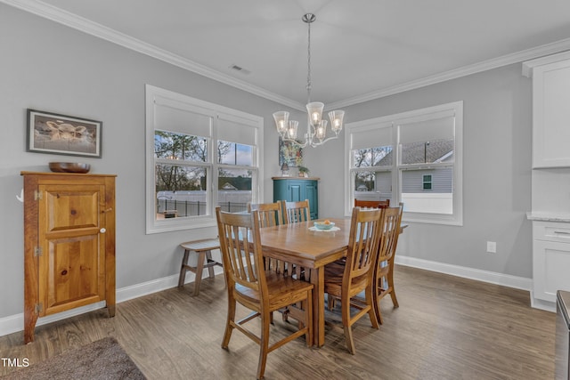 dining area with a notable chandelier, plenty of natural light, ornamental molding, and wood finished floors