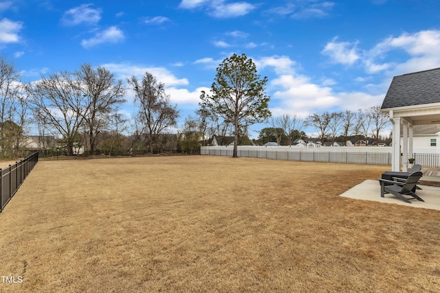 view of yard with a patio and fence