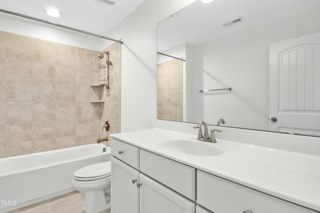 full bathroom featuring tile patterned floors, visible vents, toilet, shower / bathing tub combination, and vanity