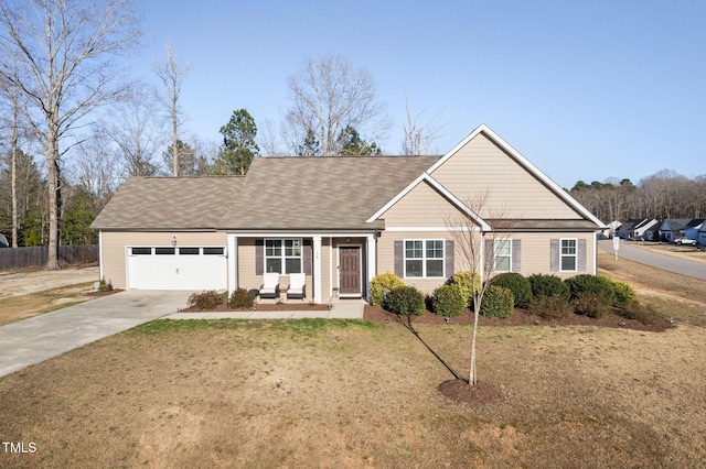 view of front of property featuring a garage, concrete driveway, a front lawn, and fence